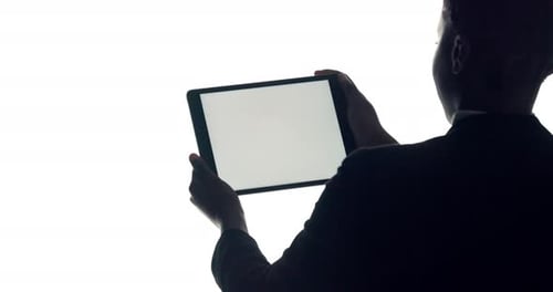 Person, hands and silhouette with tablet screen in studio for advertising on a white background