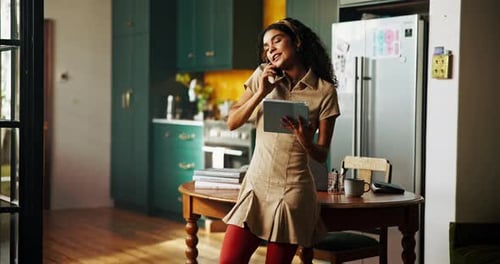 Young Woman Talking on Phone at Home