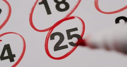 Red Pen Circles Date on Calendar Page