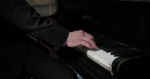 Pianist Hand Playing Piano During a Concert. - close up shot