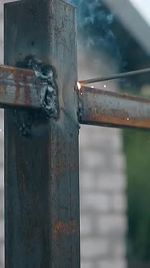 Slow Motion Closeup Builder Connects Details of House Fence