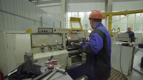 Factory Worker Operating Lathe Machine Manufacturing Metal Part Stock Clip