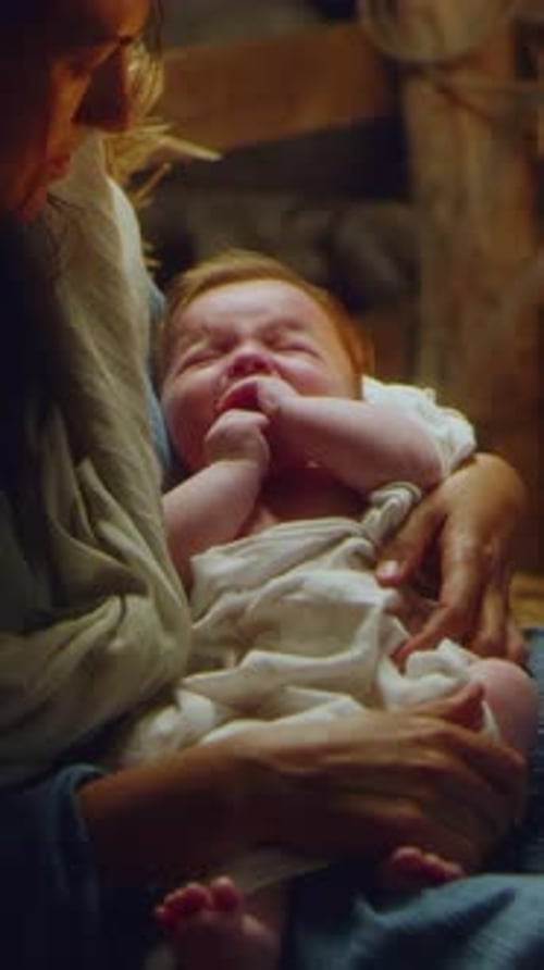 Joseph and Mary with Crying Baby Jesus Near Stalls