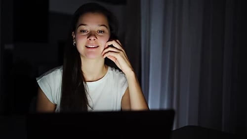 Woman Talking on Video Call at Night