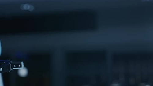 Modern Robot Arm Smoothly Moving into Focus, Unclutching it's End Effector. Industrial Robotic Mani