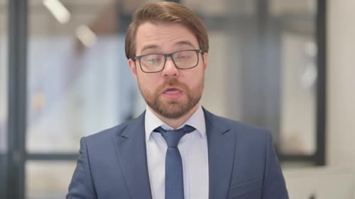 Professional Man Speaking in Office Setting