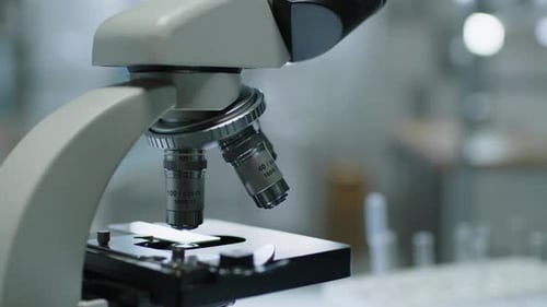 Microscope Examining Specimen in Laboratory Close Up