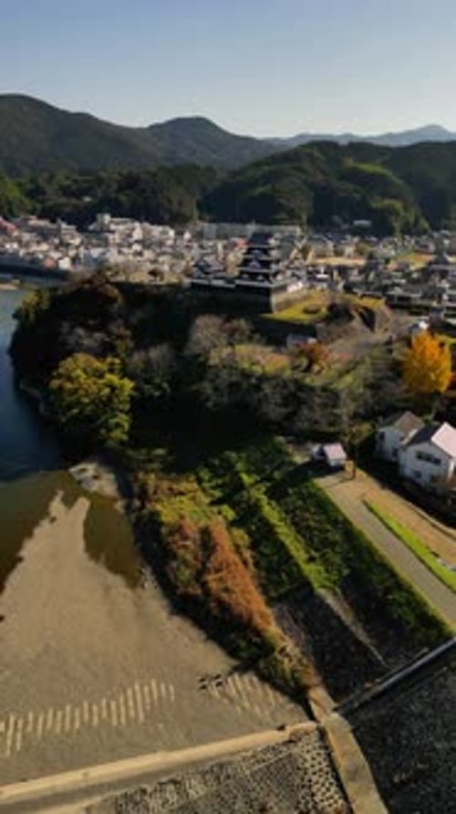 Aerial view of Ozu Castle and traditional town along the river, Japan.