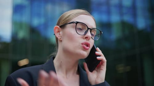 Woman Talking on Phone in Urban Setting