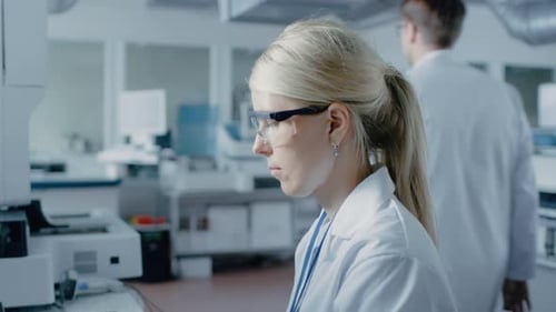 Woman Scientist Working in Modern Bright Lab