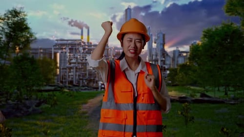 Asian Female Engineer Dancing Celebrating In Front Of Oil Refinery