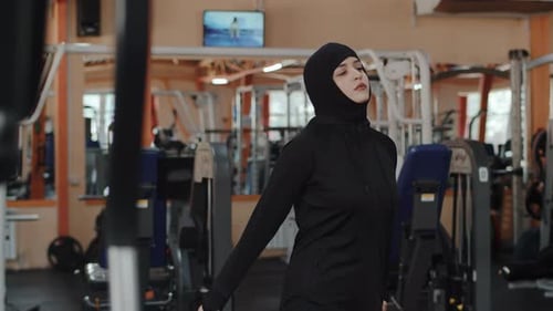 Woman Warming Up in Gym