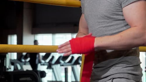 Boxer Wrapping Hands with Red Boxing Wraps