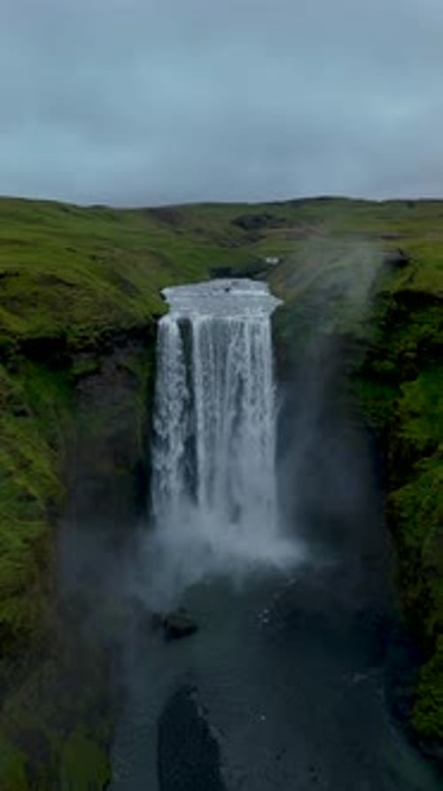 Dramatic Landscape of Skogafoss Waterfall Flowing From Volcanic Mountain in South of Iceland