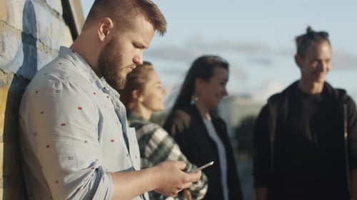 Group of Young Adults Standing Outside