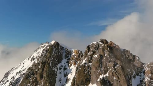 Snowy Mountain Peaks Above the Clouds. British Columbia, Canada.