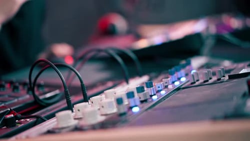 Close Up the Recording Room is Dark with Neon Lighting Prorecording Remote Control for Adjusting and
