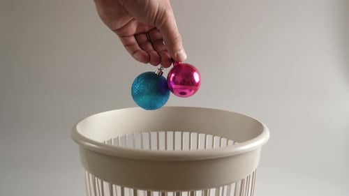 Christmas Ornaments Discarded in Trash Can