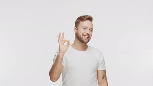 Expressive Young Man Over Vibrant Background Studio Portrait of Handsome Person
