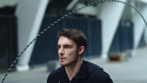 Closeup Male Athlete Jumping with Skipping Rope on Outdoor Training. Close Up