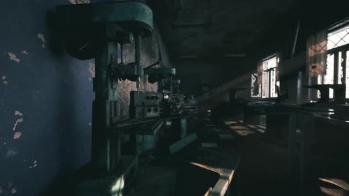 Abandoned Workshop Filled with Old Machinery and Sunlight Streaming in