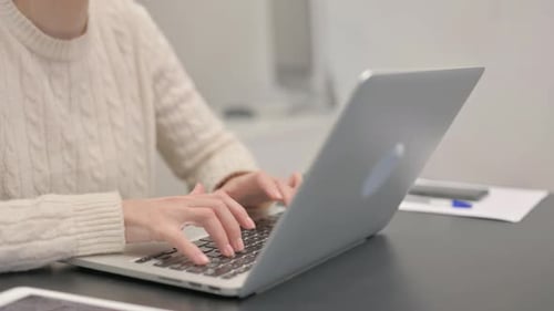 Close up of Female Hands Typing on Laptop