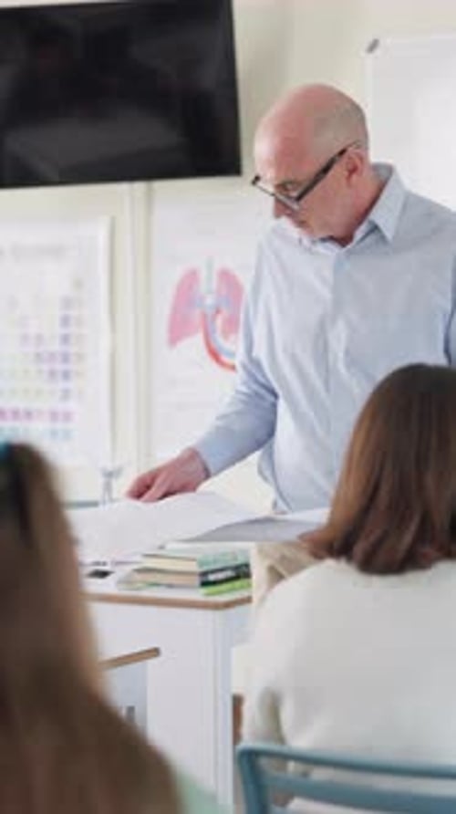 Papers, education and examination with teacher in lecture hall or classroom for project