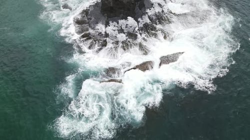 Waves Crashing Against Rocks Aerial View