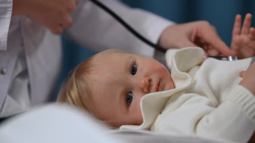 Doctor Examines Adorable Baby with Stethoscope