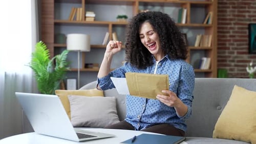 Excited Woman Reads Letter in Living Room