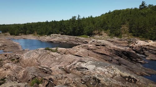 Slow pan of wide vista of Moon River Falls