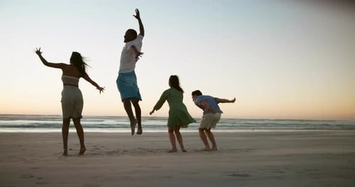 Beach, jumping and friends with vacation, back and bonding together with happiness