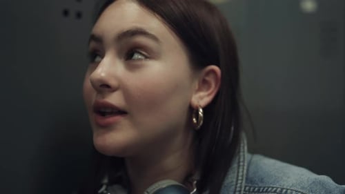 Close Up Attractive Joyful Girl Talking with Boyfriend in Collegge Hall. Portrait