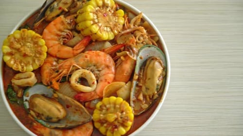Close-up Seafood Boil with Shrimp, Mussels, Corn