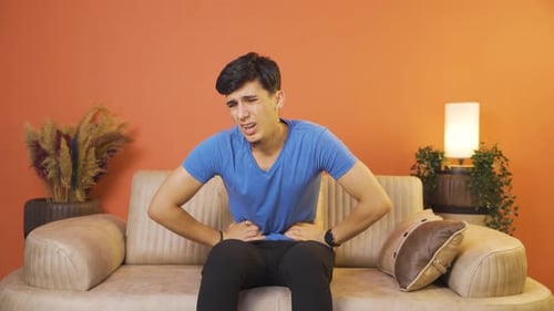 Man experiencing stomachache.