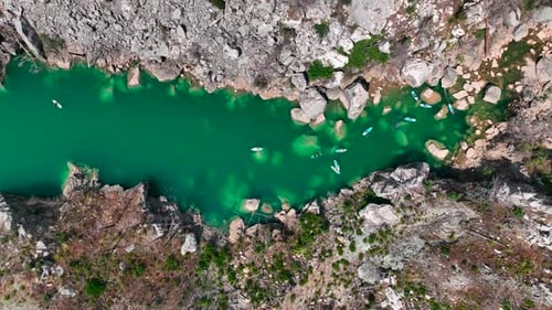 Aerial View Scenic Paddleboarding Journey in the Green Canyon People Swimming and Relaxing