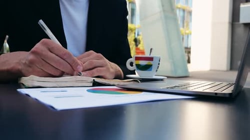 Hands of Lawyer with Documents Pointing at Paper for Businessman Signing Contract Making Marks in