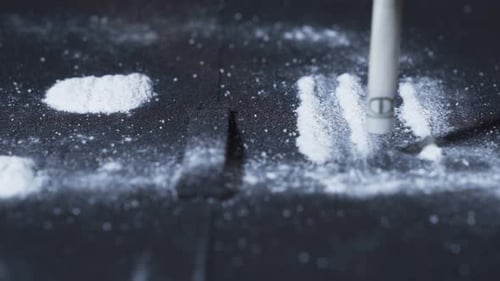 Using cocaine with paper.