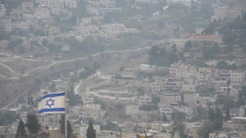 Cityscape View With Israeli Flag in Foreground