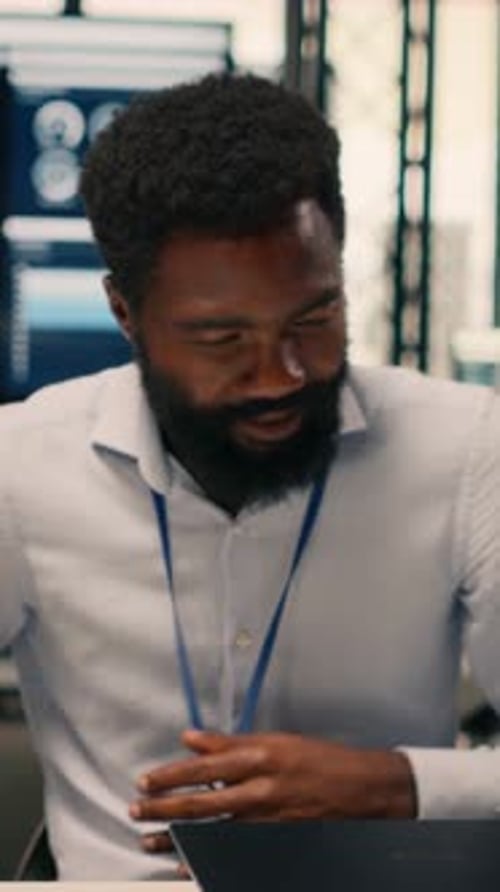 Vertical Video Black Employee Analyzing Charts and Graphs During Strategic Planning Session