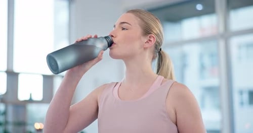 Woman Drinks Water After Workout Hydration