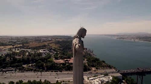 The outstretched arms of Christ the King sanctuary towards the city of Lisbon, Portugal