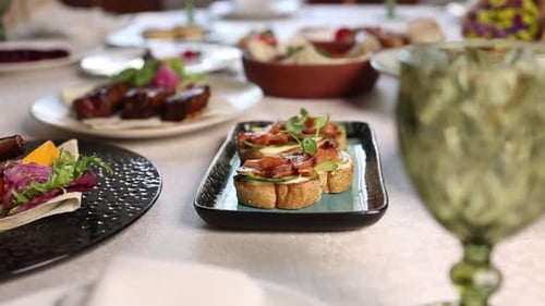 Festive banquet table in a restaurant. Served with delicious dishes.