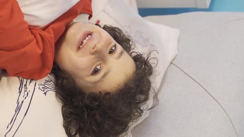 Smiling Child Lying Down Close Up