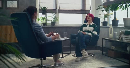 In Psychotherapy Room Teenage Girl Talk to Her Therapist