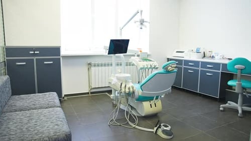 Modern Dental Office with Dental Chair and Equipment