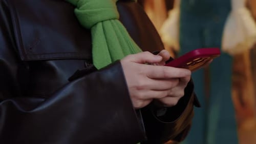 Woman Using Mobile Phone in Urban Environment