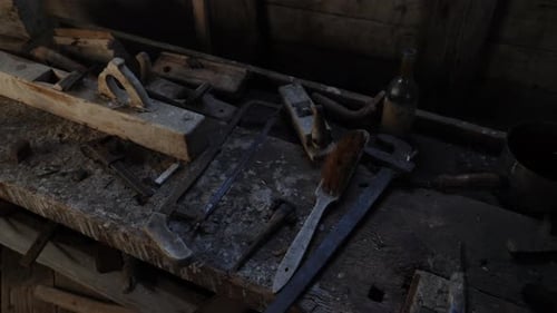 Old dark wood shop in an antique mill with hand plane tool for carpentry