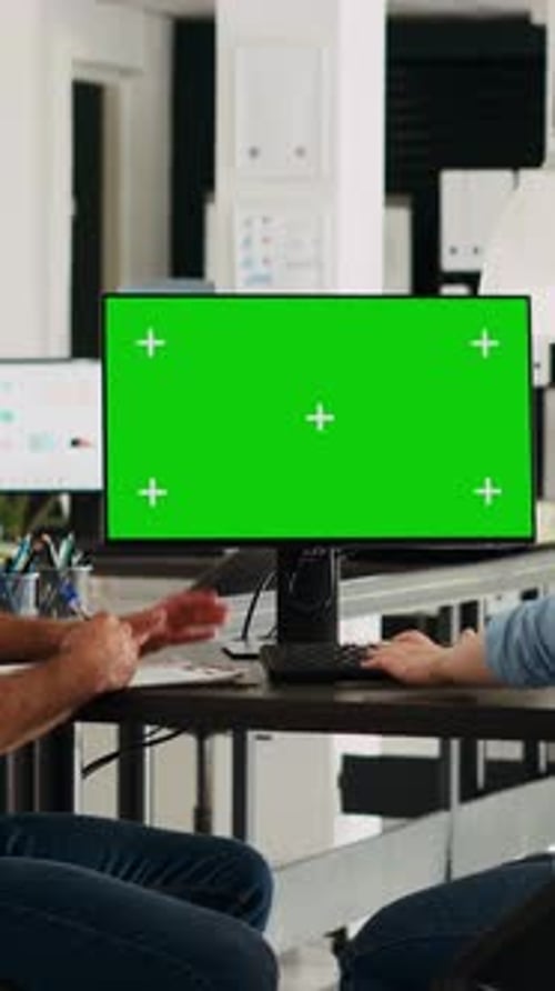 Vertical Video Startup Team Looking at Pc Greenscreen