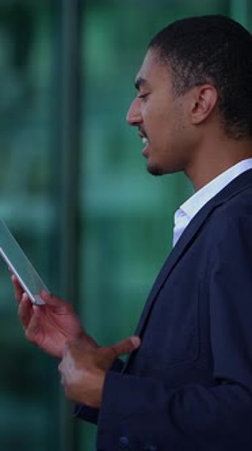 An Engaged Professional Actively Using a Tablet in a Modern Office Environment Today